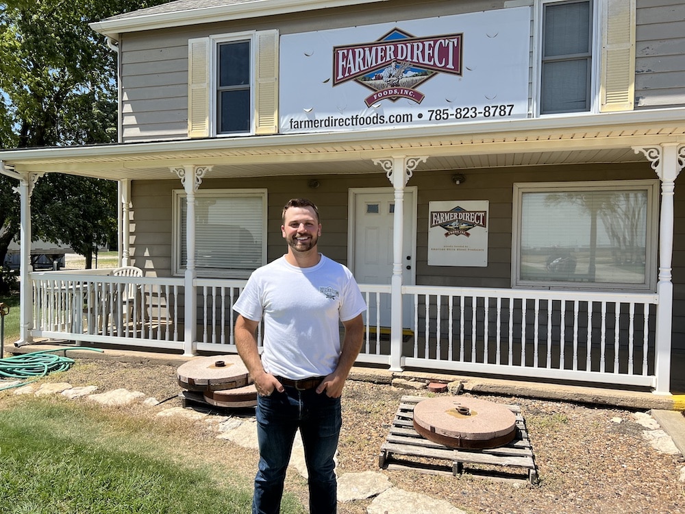 Keaton Hale standing outside of Farmer Direct Foods in New Cambria, Kansas